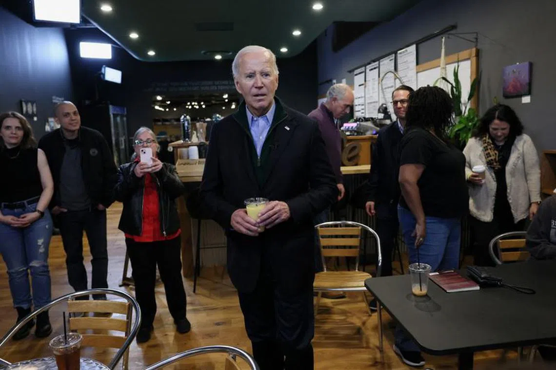 U.S. President Joe Biden answers questions from the press at Nowhere Coffee Co. in Emmaus, Pennsylvania, U.S., January 12, 2024. REUTERS/Leah Millis
