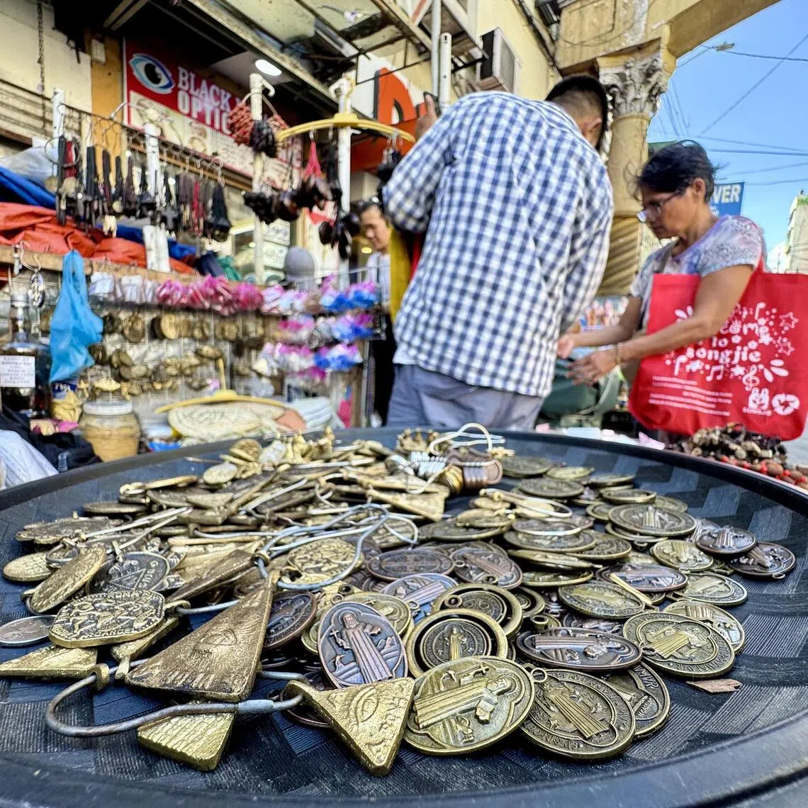 maletter - Medallions bearing the image of Saint Benedict, believed by Catholics to provide protection, are sold by one vendor in Quiapo, Manila alongside different talismans and amulets meant to ward off evil spirits.
ST PHOTO: MARA CEPEDA