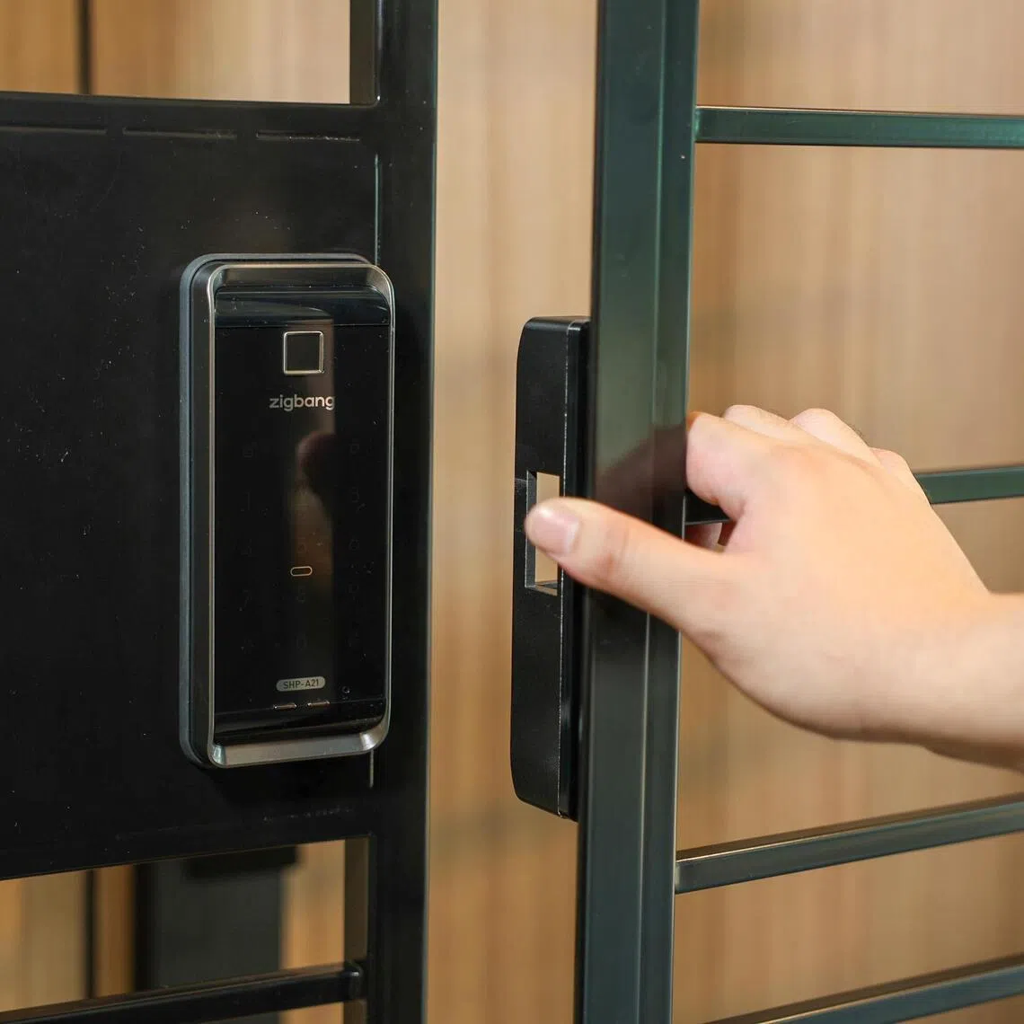 Models of digitally locked HDB BTO gates and doors at AN Digital Lock's showroom.