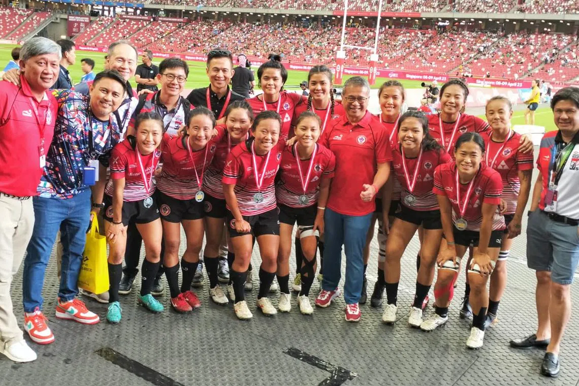 Singapore women's rugby national team players posing for a team photo after winning silver following their 22-7 defeat to Thailand at the South-east Asia (SEA) Sevens at the Singapore Sports Hub on Saturday.
