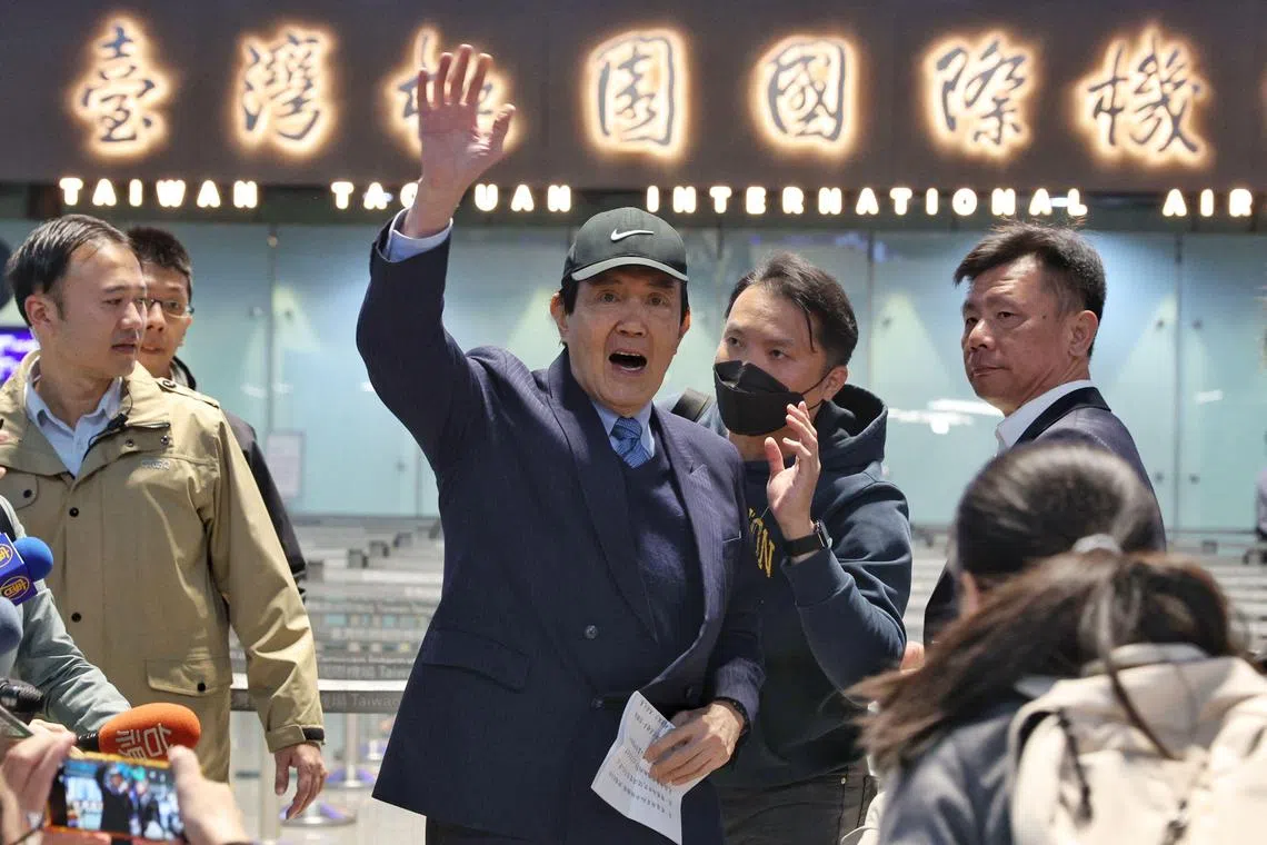Taiwan's former president Ma Ying-jeou waves to the media at Taoyuan International Airport before leading a delegation of Taiwanese students to China, in Taoyuan on December 18, 2024. (Photo by I-Hwa Cheng / AFP)