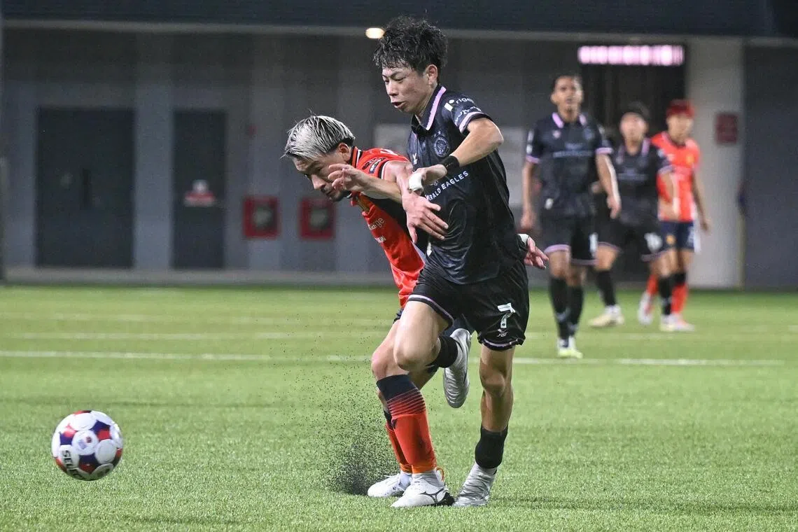 Geylang International's Riku Fukashiro (right) tussles with Hougang United's Yuta Kikuchi who was later sent off for a headbutt on Fukashiro.