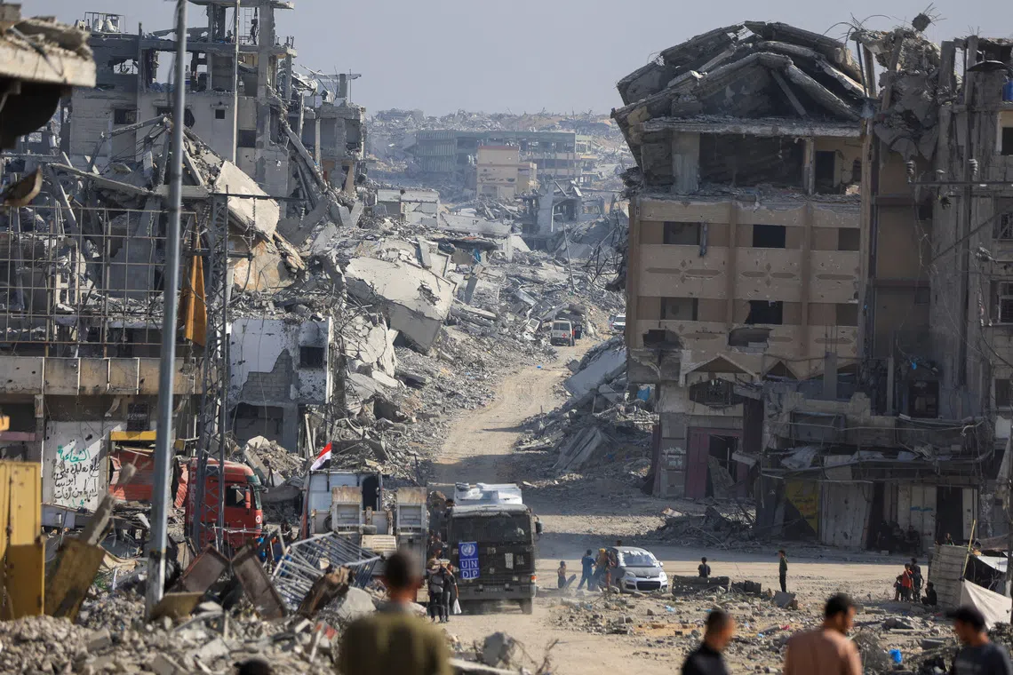 Red Cross personnel working in an area within the so-called "yellow line" to which Israeli troops withdrew under the ceasefire, in Gaza City on Nov 2.