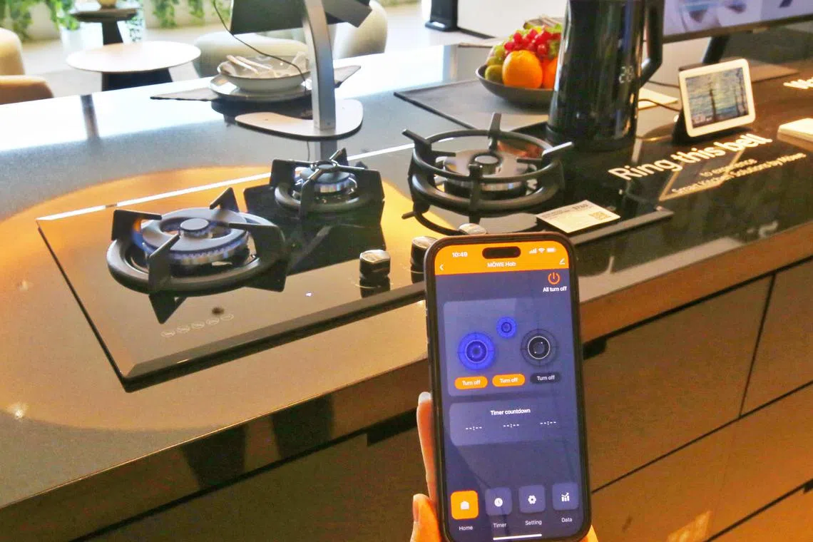 A gas hob operated via an app is among the smart devices for a green home showcased at City Energy's new store at Plaza Singapura.