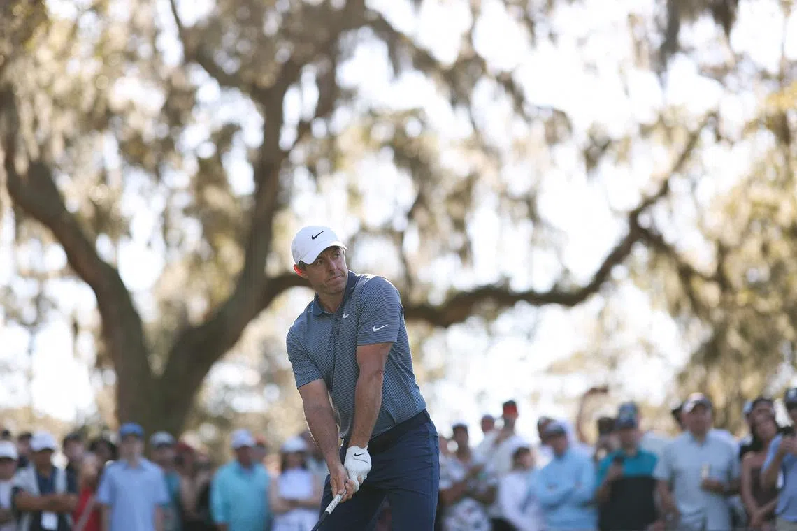 Rory McIlroy of Northern Ireland tees off on the 12th hole during the first round of The Players Championship.