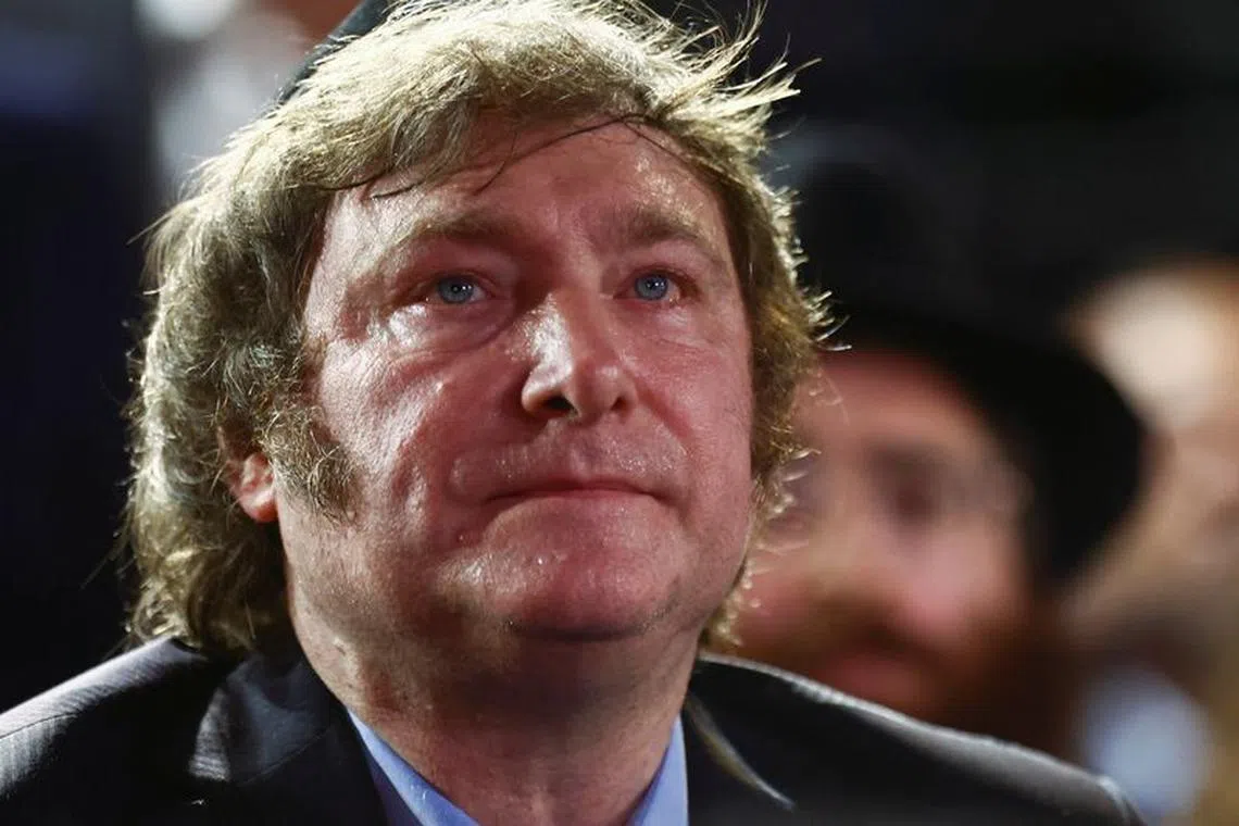 FILE PHOTO: Argentina's President Javier Milei looks on as he attends a Hanukkah celebration in Buenos Aires, Argentina, December 12, 2023. REUTERS/Tomas Cuesta/File Photo