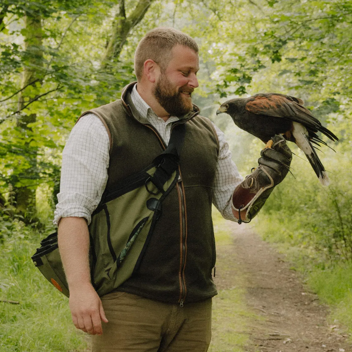 Falconer Richard Scot with a hawk on the estate at Gleneagles, a luxury hotel built in the manner of the great Scottish castles, in Auchterarder, Scotland.