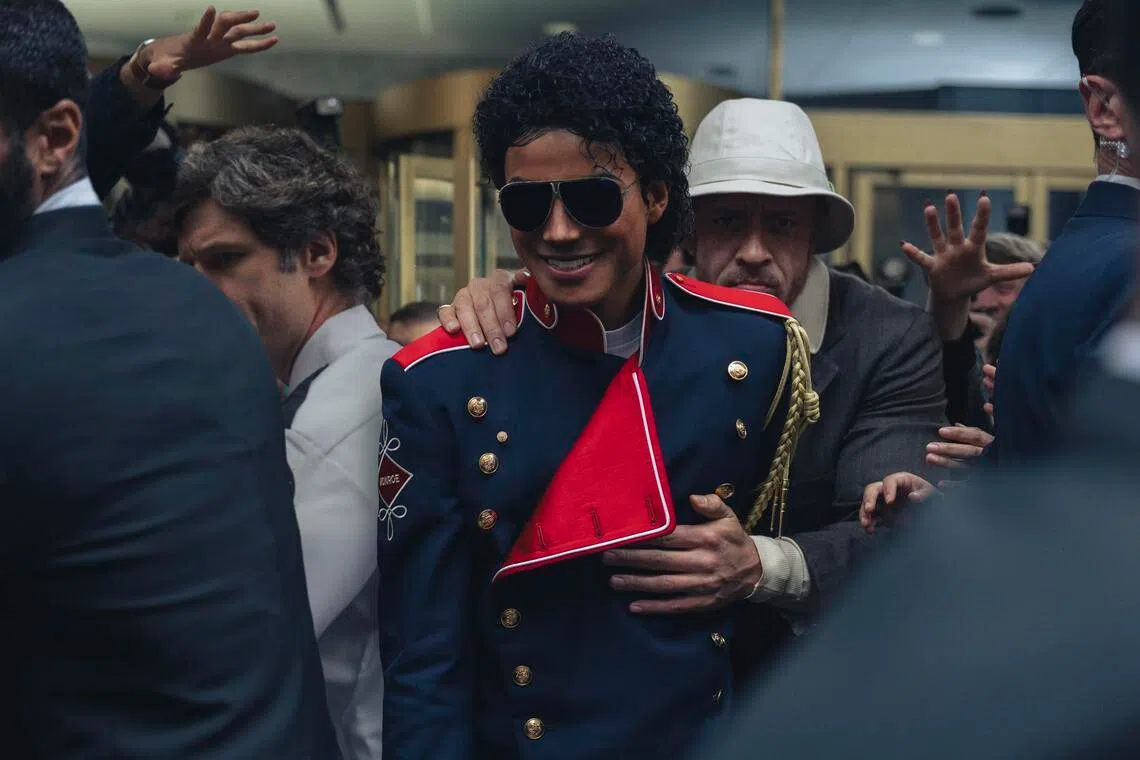 Jaafar Jackson (middle) as Michael Jackson and KeiLyn Durrel Jones (behind) as Jackson's bodyguard Bill Bray in Michael.