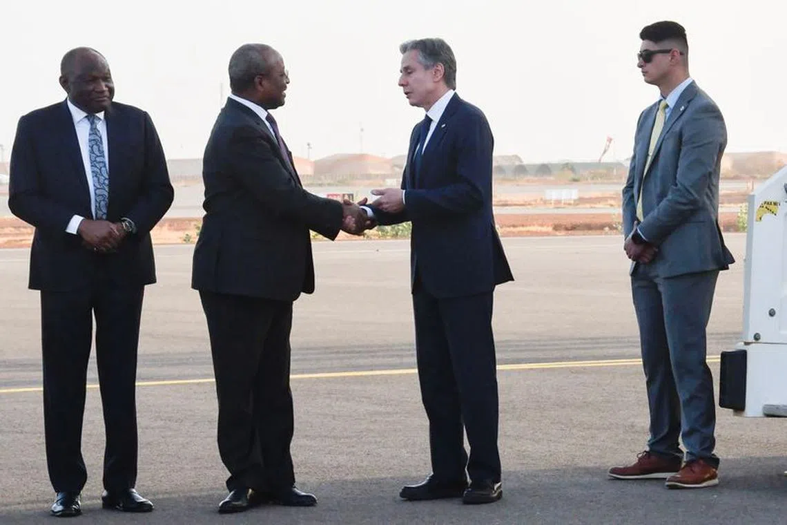 US Secretary of State Antony Blinken shakes hands with Nigerien Foreign Minister Hassoumi Massoudou before departing Niger at the Diori Hamani International Airport in Niamey, Niger, on March 17, 2023. BOUREIMA HAMA/Pool via REUTERS