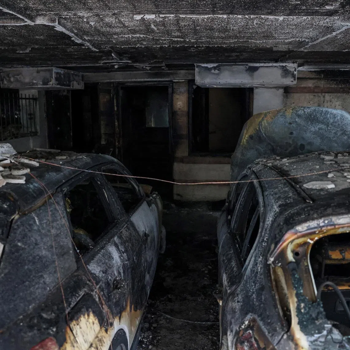 Burned out cars, after attackers firebombed three residential buildings linked to Greece's governing party in the northern city of Thessaloniki, Greece, July 1, 2026. REUTERS/Alexandros Avramidis