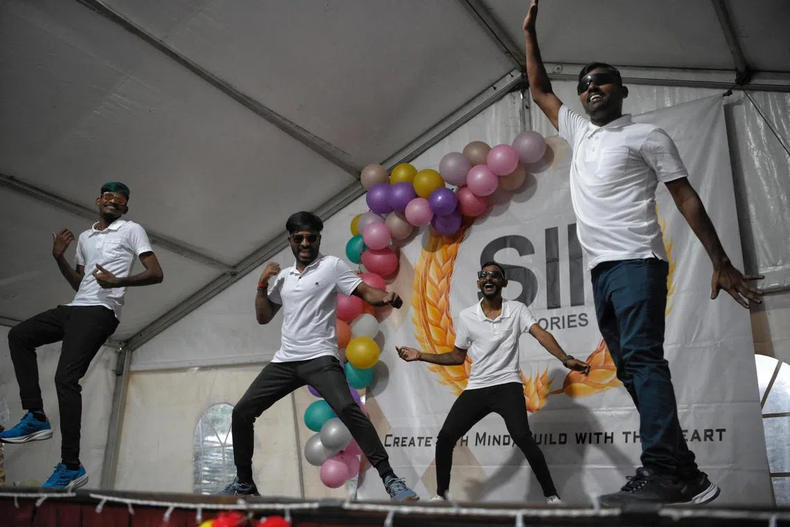 A dance group called the Thangavelu Boys, who are also residents at Changi Lodge 2 Dormitory, perform during Deepavali Celebrations on November 12, 2023.