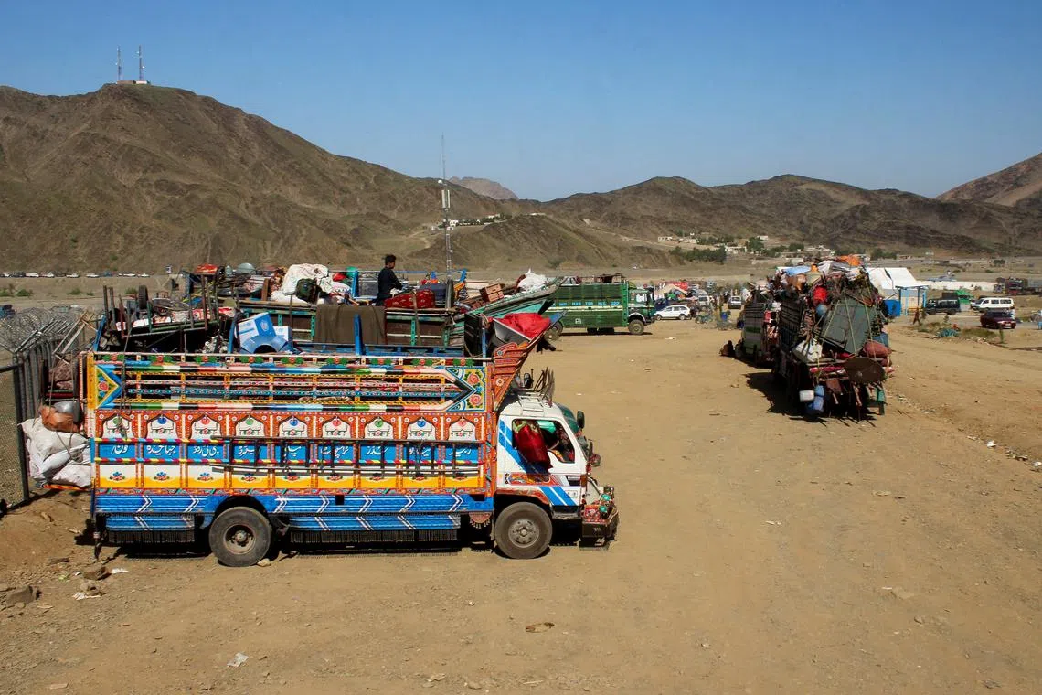 FILE PHOTO: Trucks transporting Afghan nationals who were expelled from Pakistan await registration at the Omari refugee camp in Mohmand Dara, Torkham border, Nangarhar province, Afghanistan, April 15, 2025. REUTERS/Hedyatshah Hedayat/File Photo
