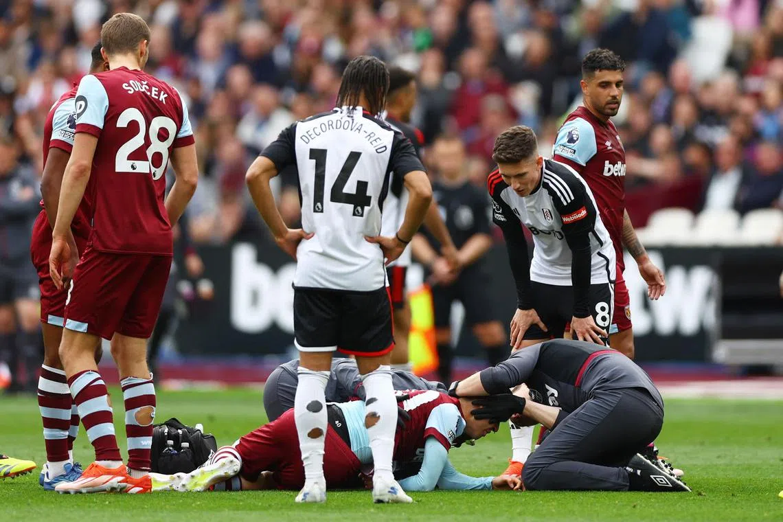 West Ham United's George Earthy receives medical attention after suffering what appeared to be a worrying head injury.