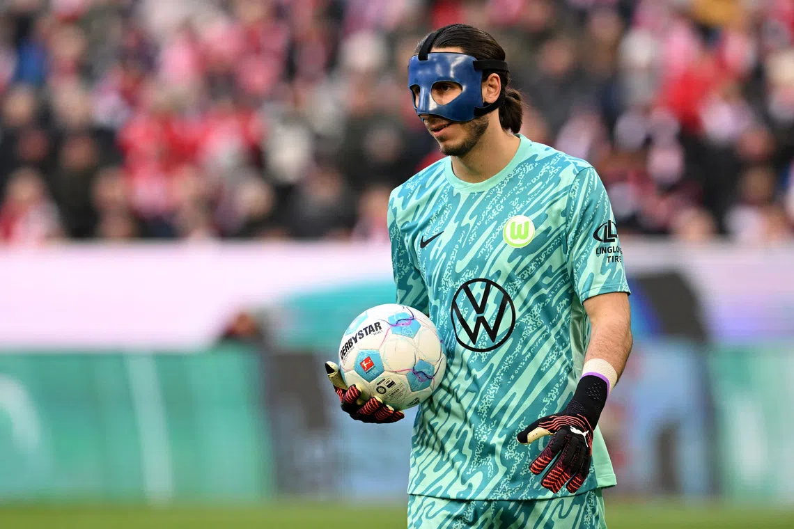 FILE PHOTO: Soccer Football - Bundesliga - Bayern Munich v VfL Wolfsburg - Allianz Arena, Munich, Germany - January 18, 2025 VfL Wolfsburg's Kamil Grabara holds the ball during the match REUTERS/Angelika Warmuth/File Photo