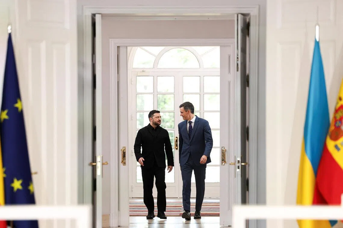 Ukrainian President Volodymyr Zelensky (left) and Spanish Prime Minister Pedro Sanchez arriving for a joint press conference in Madrid on March 18.