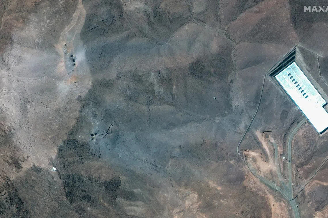 A closer satellite view shows the ridge at Fordow underground complex, after the U.S. struck the underground nuclear facility, near Qom, Iran June 22, 2025.     MAXAR TECHNOLOGIES/Handout via REUTERS