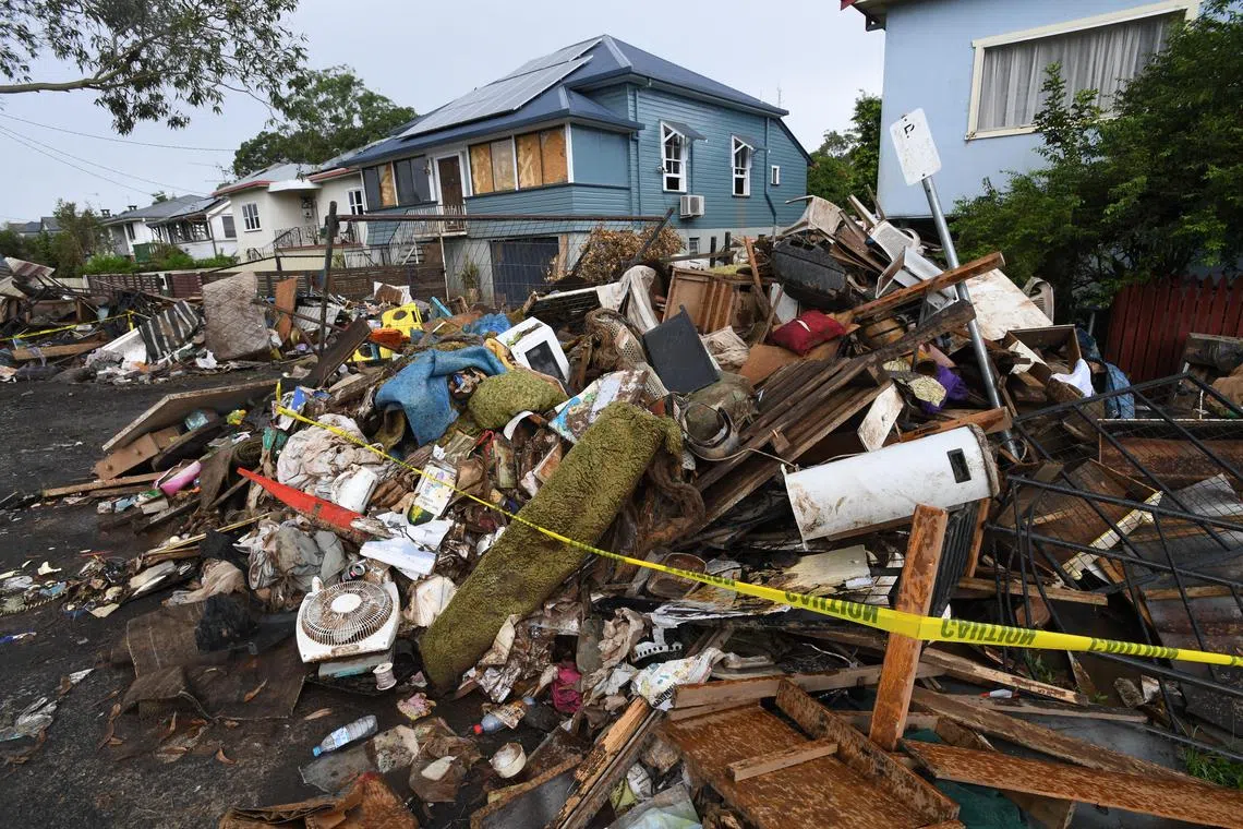 Flood-damaged homes seen in Lismore, Australia, in March 29 last year.