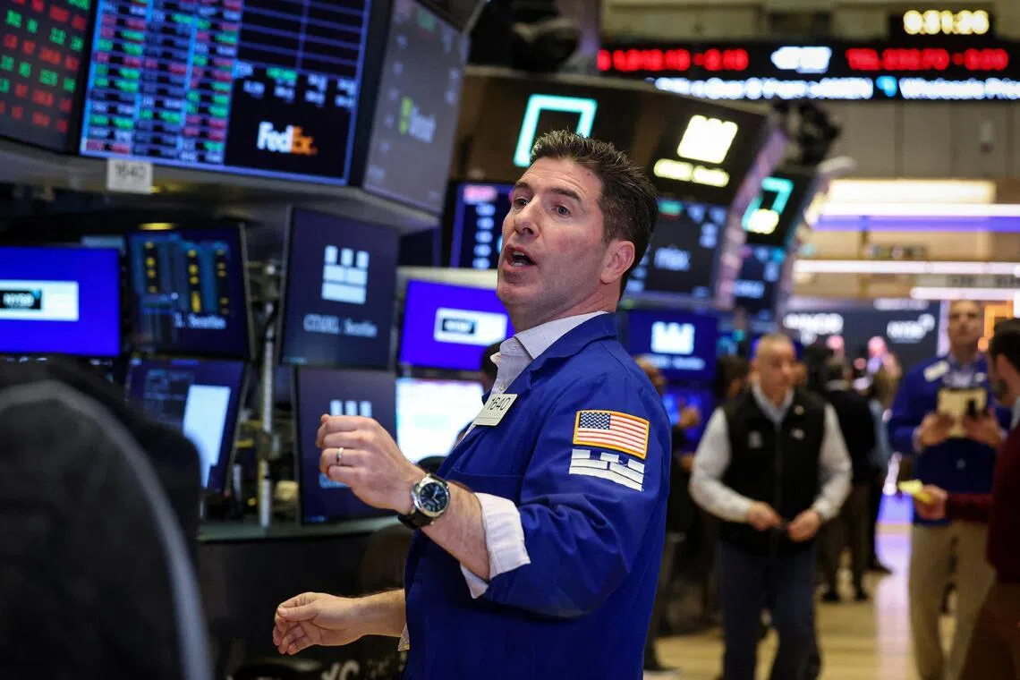 Traders working on the floor of the New York Stock Exchange, in New York City, on Feb 27. 