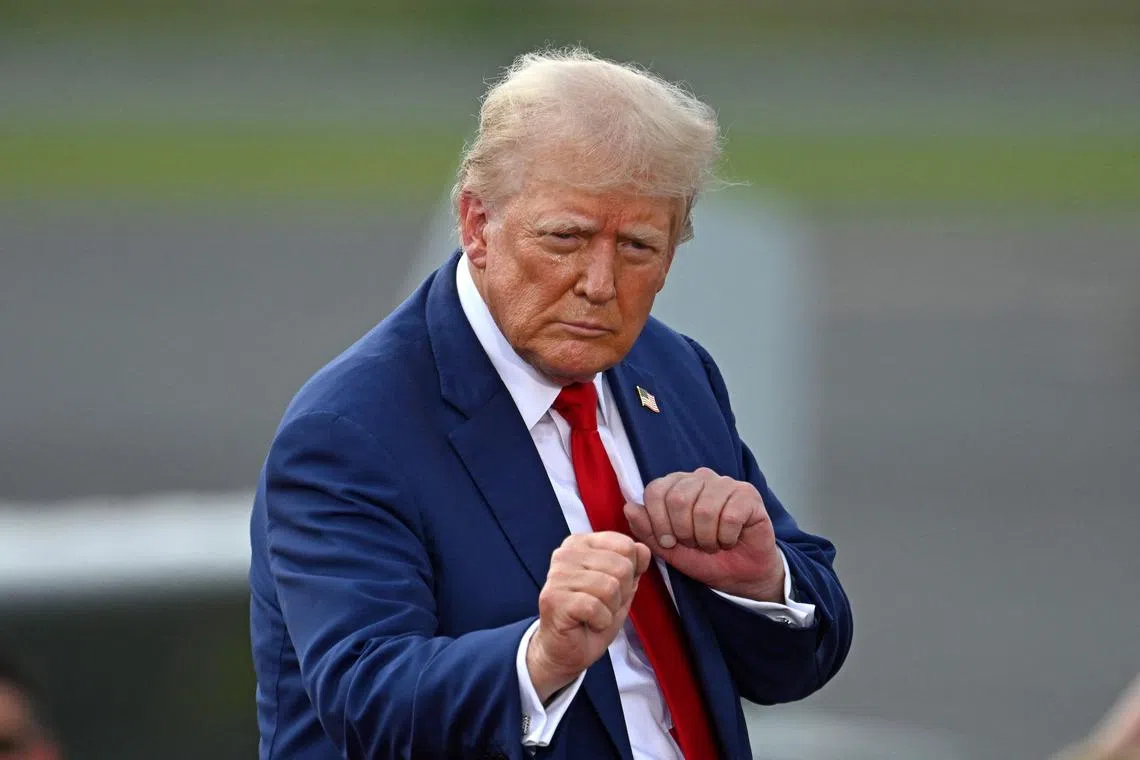 Former US president and Republican presidential candidate Donald Trump gesturing during a campaign rally in Asheboro, North Carolina.