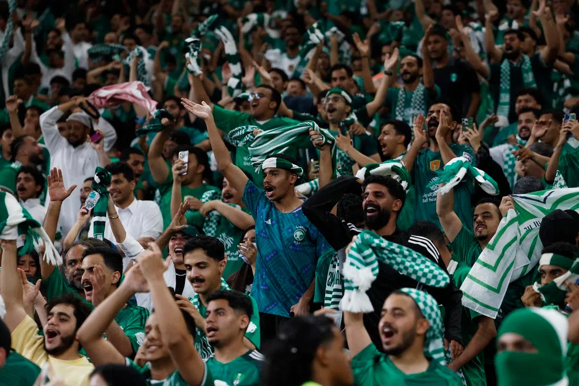 Soccer Football - Asian Champions League - Final - Al Ahli v Machida Zelvia - King Abdullah Sports City Stadium,  Jeddah, Saudi Arabia - April 25, 2026 Al Ahli fans celebrate after Feras Al-Brikan scores their first goal REUTERS/Ibraheem Abu Mustafa