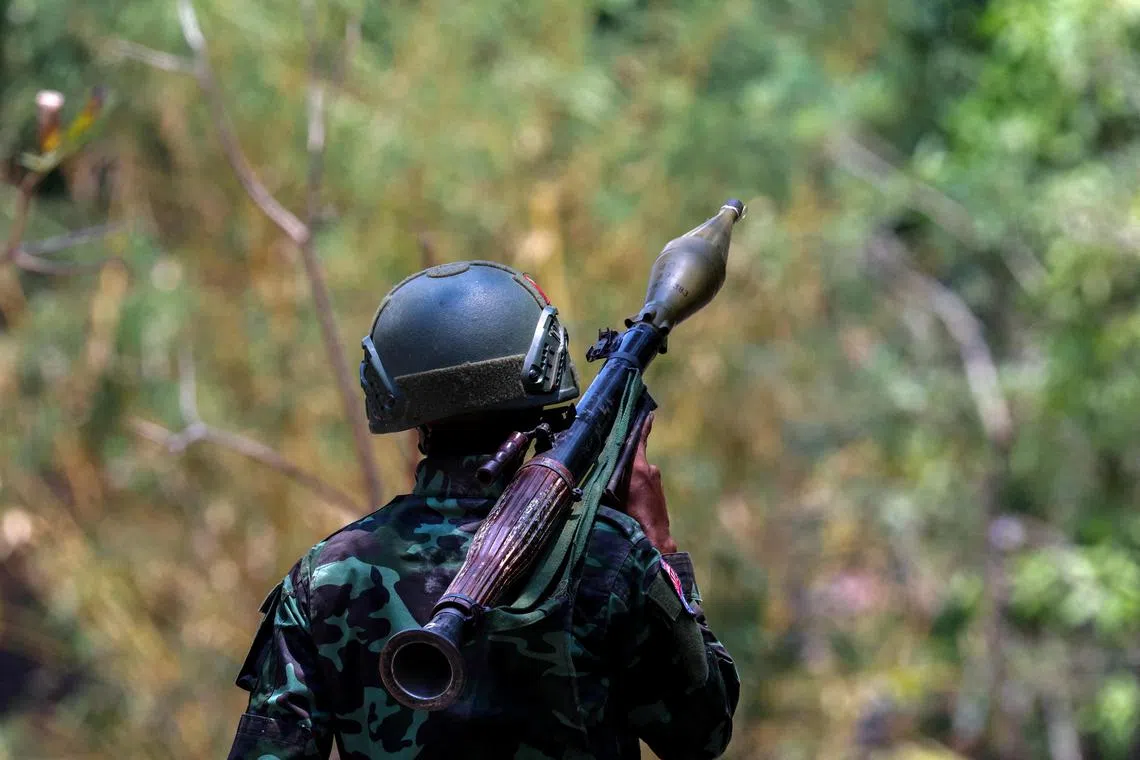 A soldier from the Karen National Liberation Army carries an RPG launcher at a military base the rebels seized on the outskirts of Myawaddy.