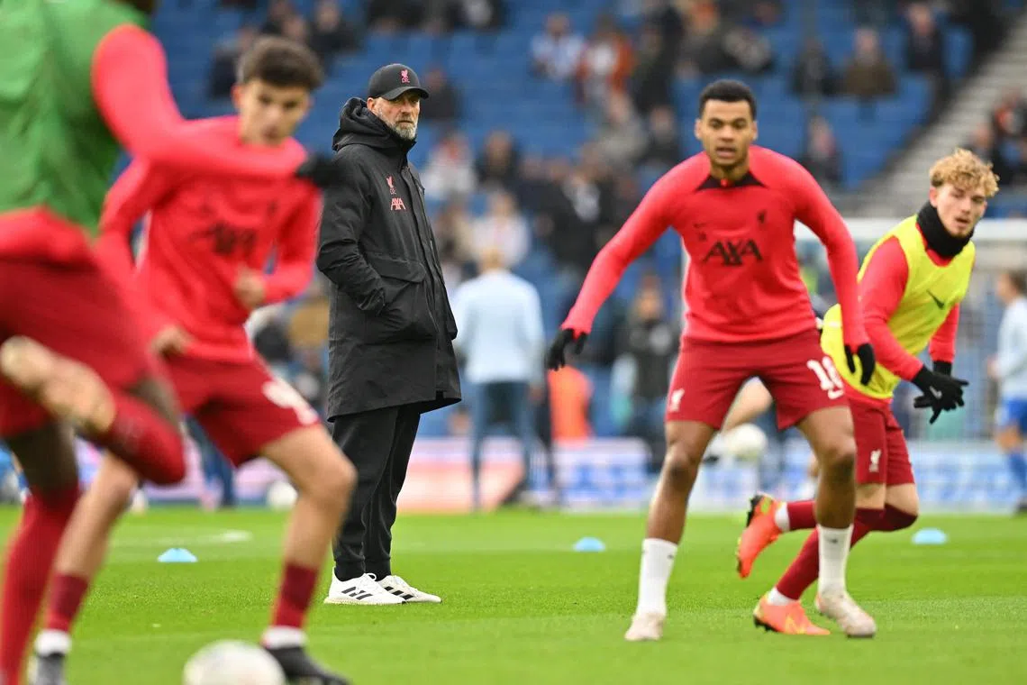 Liverpool manager Jurgen Klopp watches his players warm up ahead of the FA Cup fourth-round clash against Brighton & Hove Albion.