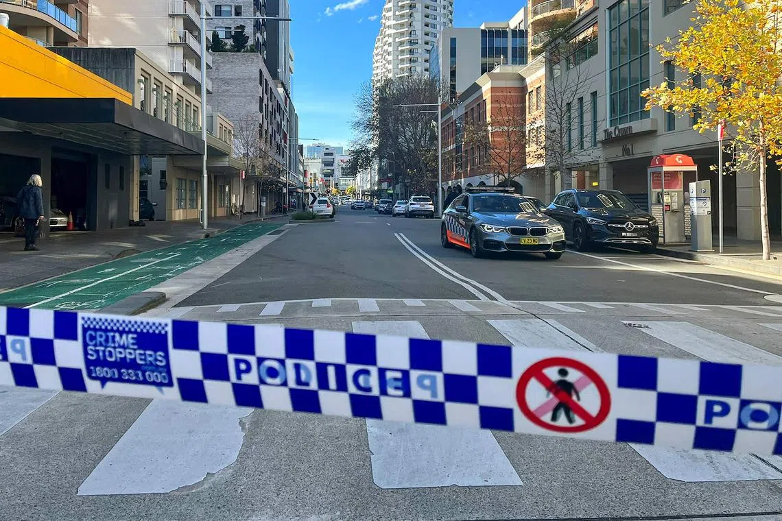 Police block off a street at Bondi Junction, an eastern suburb of Sydney on June 27, 2023 after a suspected shooting incident. (Photo by Andrew LEESON / AFP)
