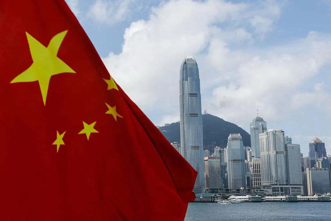 The Chinese national flag is seen in front of the financial district Central on the Chinese National Day in Hong Kong, China October 1, 2022. REUTERS/Tyrone Siu