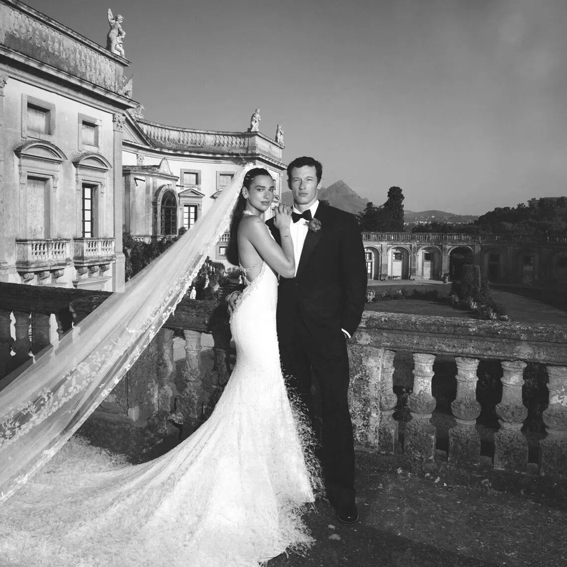 Dua Lipa in a custom haute couture wedding dress by Chanel. Groom Callum Turner wore bespoke Louis Vuitton.