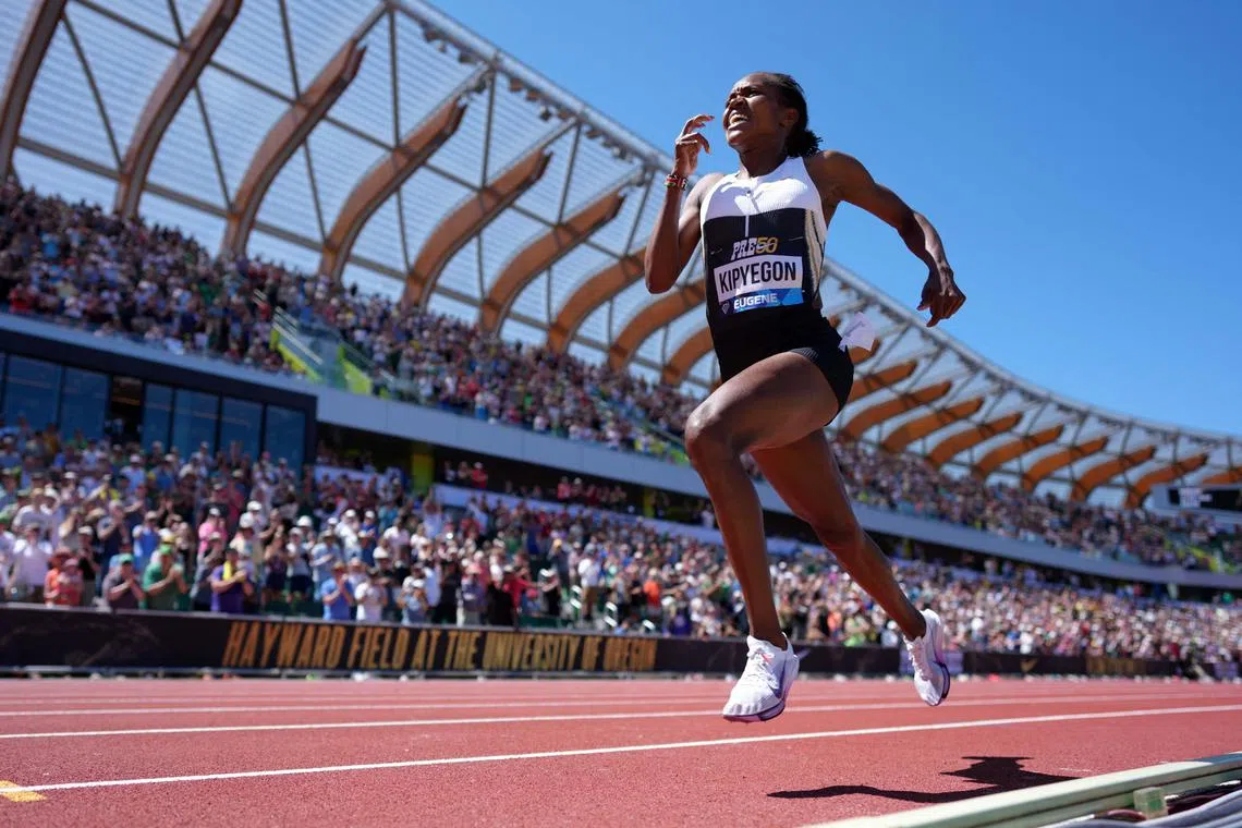 Faith Kipyegon wins the women's 1,500m in a world record 3:48.68 during the 50th Prefontaine Classic at Hayward Field.