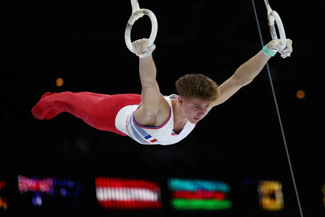 France's Benjamin Osberger in action on the rings during the men's qualifying competition on Oct 1.