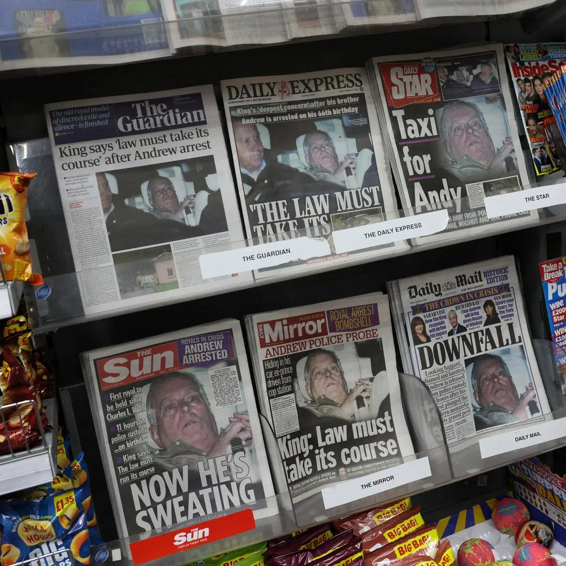 British newspapers, featuring coverage of the arrest of Andrew Mountbatten-Windsor, younger brother of Britain's King Charles, on suspicion of misconduct in public office, sit on display in a newsagent in London, Britain, February 20, 2026. REUTERS/Jack Taylor