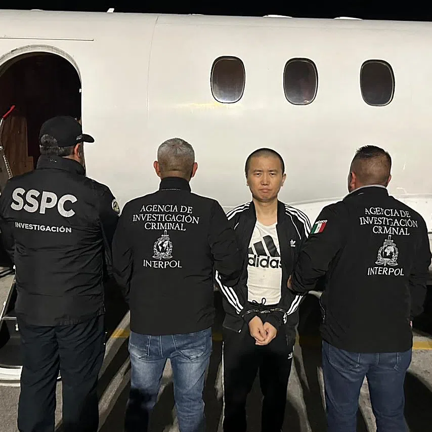 A picture posted on X in October showing alleged Chinese fentanyl kingpin Zhi Dong Zhang being escorted by Interpol officers in Mexico City.