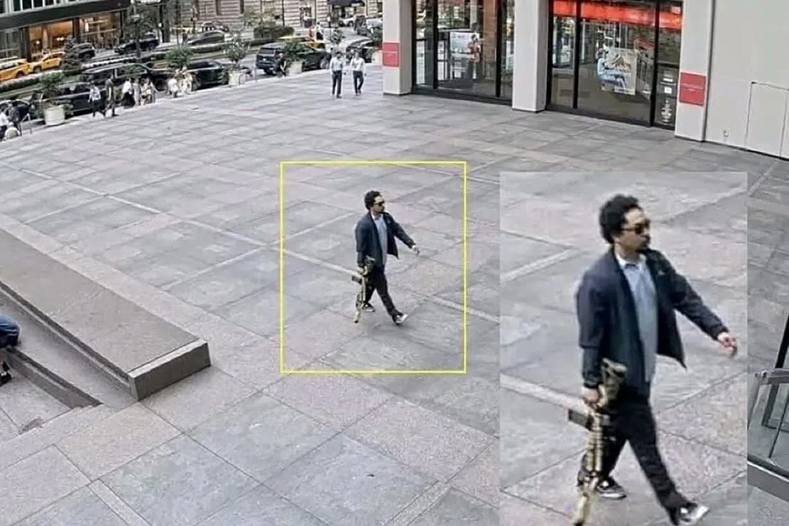 A man holding a rifle walks into an office building at 345 Park Avenue shortly before a shooting that killed several people, in the Midtown Manhattan district of New York City, U.S. July 28, 2025, in a still image taken from surveillance video. Surveillance Camera/Handout via REUTERS