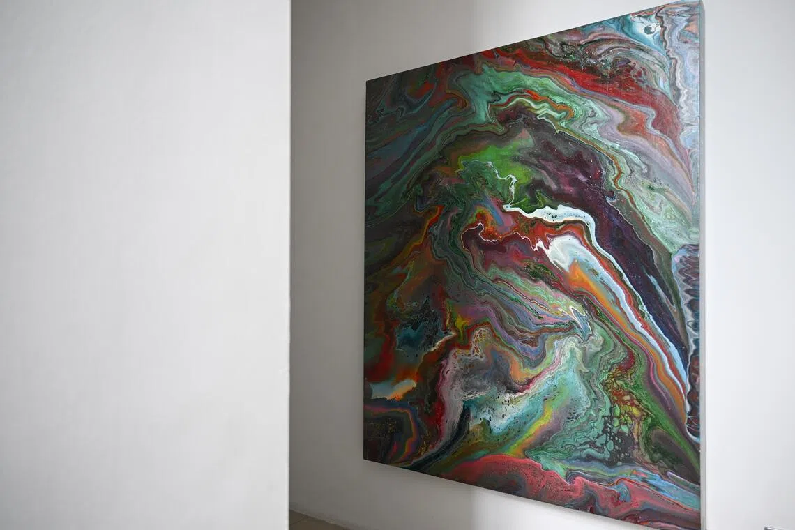 Cellini founder Tan Cheng Whatt’s home is filled with his artworks, such as this acrylic pour painting.