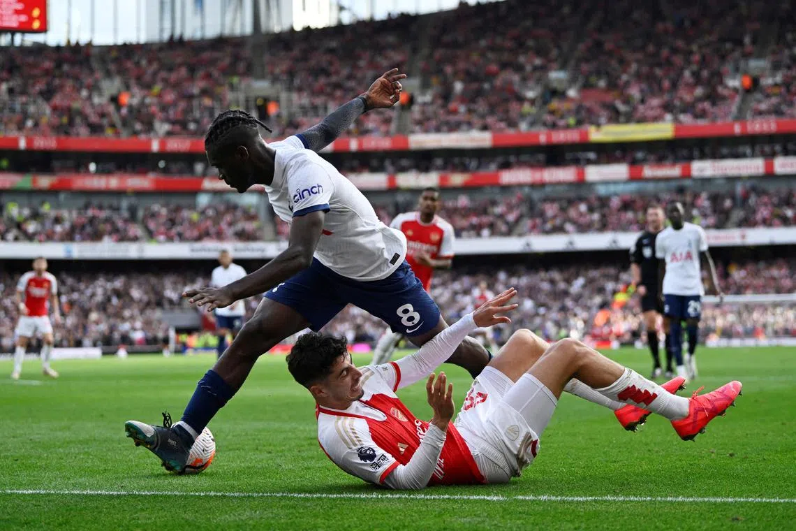 FILE PHOTO: Soccer Football - Premier League - Arsenal v Tottenham Hotspur - Emirates Stadium, London, Britain - September 24, 2023 Tottenham Hotspur's Yves Bissouma in action with Arsenal's Kai Havertz REUTERS/Tony Obrien/File Photo