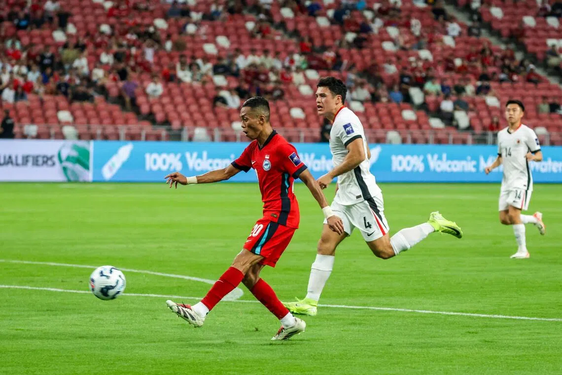 Singapore's Shawal Anuar (left) in action during the Asian Cup qualifier against Hong Kong at the National Stadium in March.
