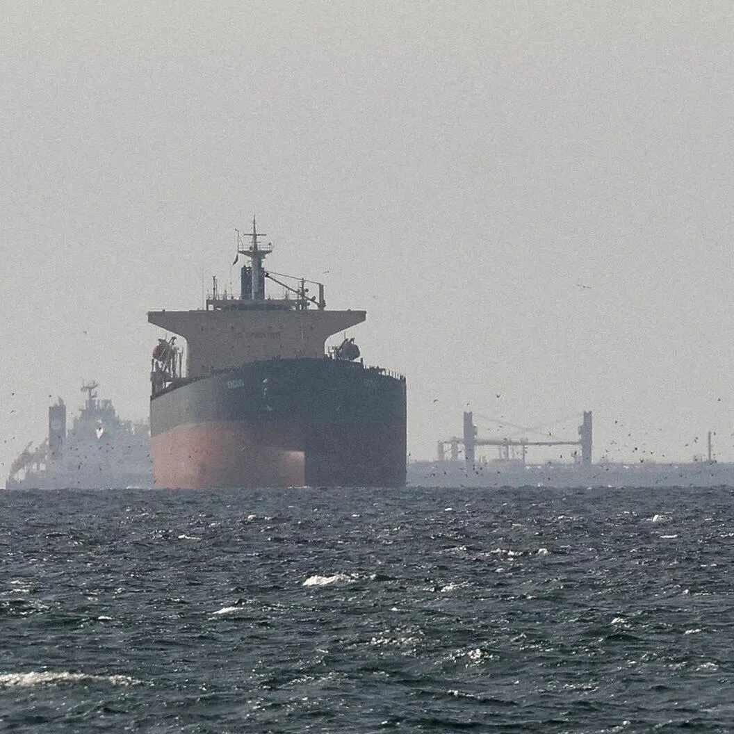 Cargo ships in the Gulf, near the Strait of Hormuz, as seen from northern Ras al-Khaimah,  in the United Arab Emirates.