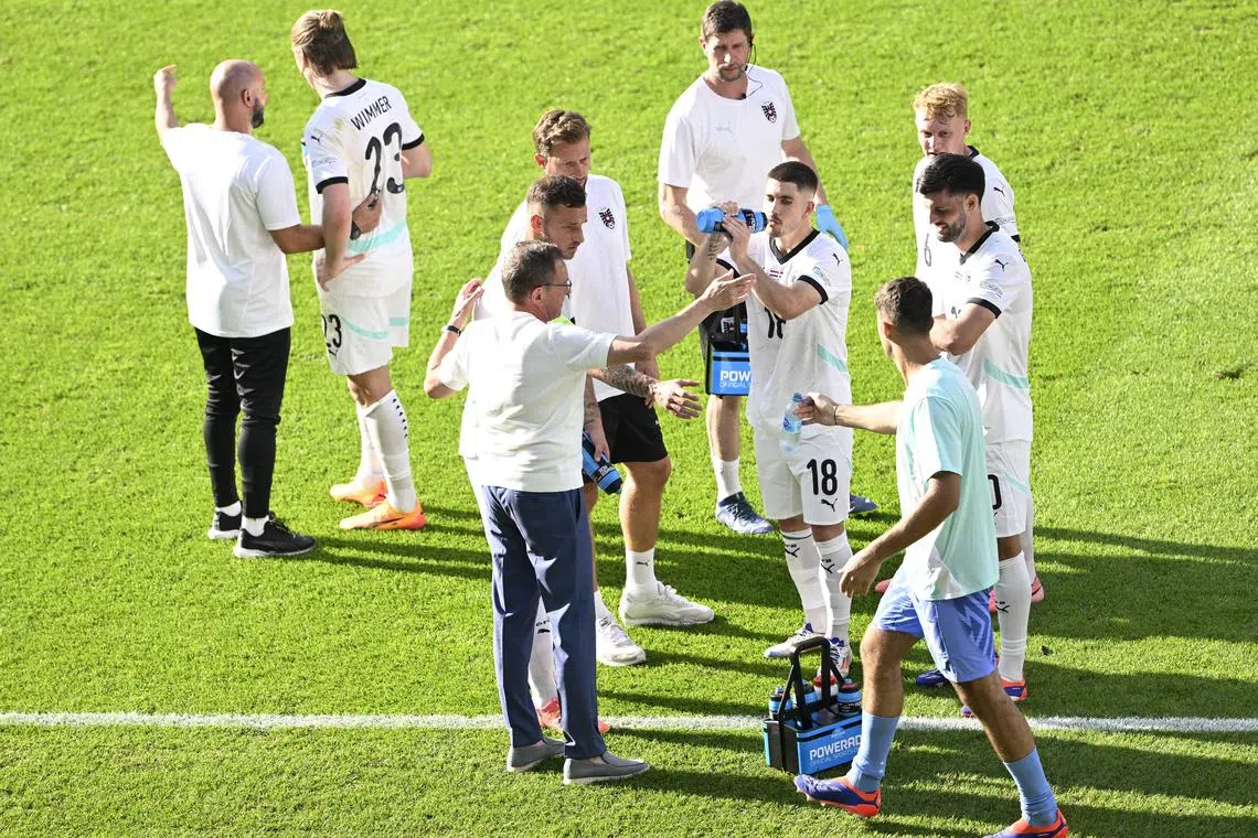 FILE PHOTO: Soccer Football - Euro 2024 - Group D - Netherlands v Austria - Berlin Olympiastadion, Berlin, Germany - June 25, 2024 Austria coach Ralf Rangnick talks to players during a drinks break REUTERS/Fabian Bimmer/File Photo