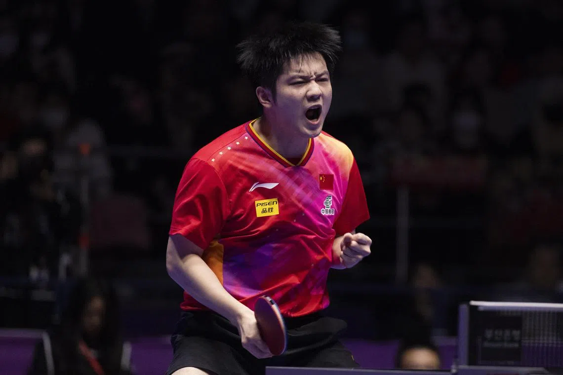 Fan Zhendong of China reacts after scoring a point against Lim Jong-hoon of South Korea during the men's semi-finals of the 2024 ITTF World Team Table Tennis Championships Finals at Busan Exhibition and Convention Centre.
