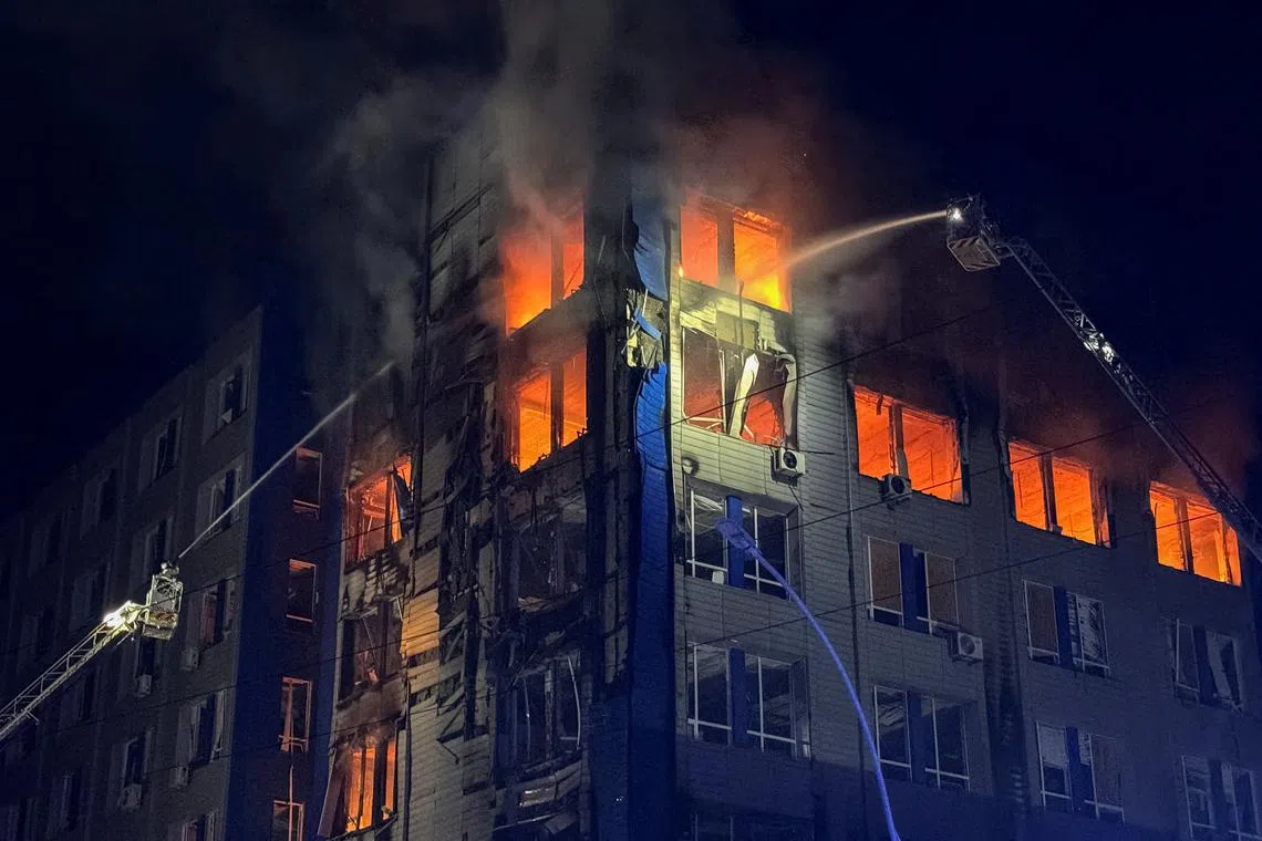 FILE PHOTO: Firefighters work at the site of a Russian drone strike, amid Russia's attack on Ukraine, in Zaporizhzhia, Ukraine May 6, 2025. REUTERS/Sergiy Chalyi/File Photo