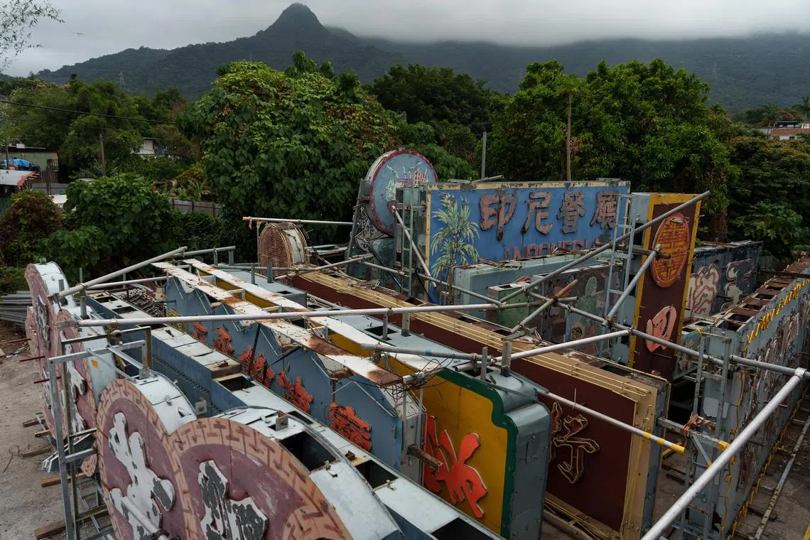 Dozens of removed neon signboards sitting at a storage place of the Tetra Neon Exchange (TNX) - a neon heritage group - in the northwest of Hong Kong, March 21, 2023.
