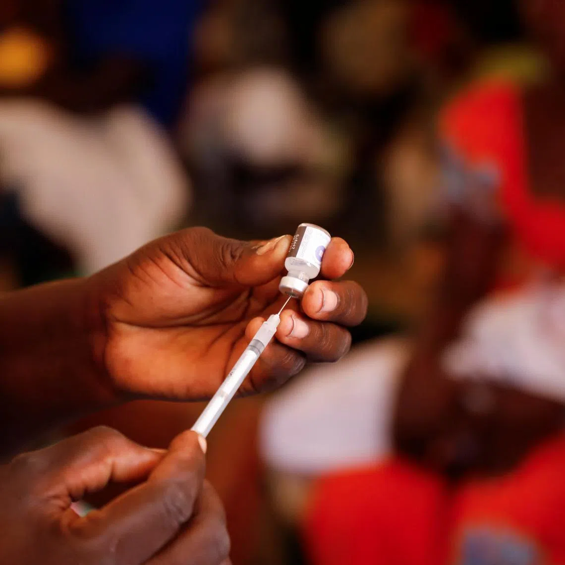 FILE PHOTO: A nurse prepares to administer a malaria vaccine to an infant at the health center in Datcheka, Cameroon January 22, 2024. REUTERS/Desire Danga Essigue/ File Photo