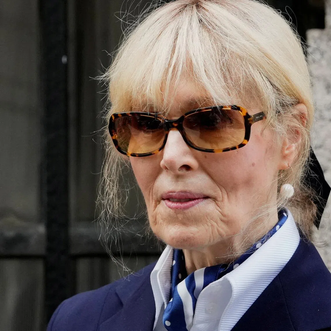 FILE PHOTO: Writer E. Jean Carroll leaves the 2nd U.S. Circuit Court of Appeals, where former U.S. President Donald Trump is asking a federal appeals court to overturn a $5 million jury verdict finding him liable for sexually assaulting and defaming her, who accused Trump of raping her nearly three decades ago, in Manhattan, New York, U.S., September 6, 2024. REUTERS/Adam Gray/File Photo