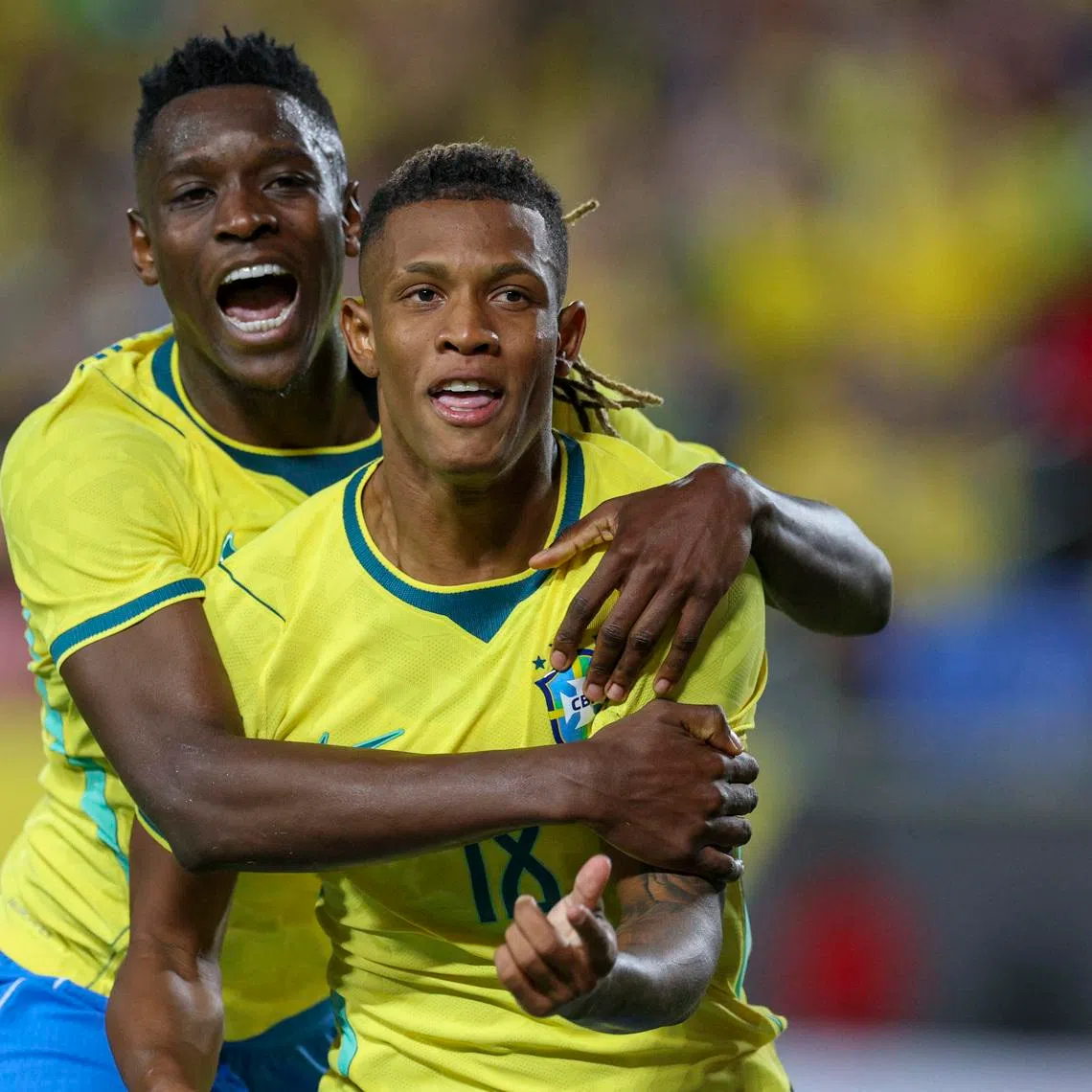 Mar 31, 2026; Orlando, Florida, USA; Brazil midfielder Danilo (18) reacts with forward Luiz Henrique (20) after scoring a goal against Croatia in the first half during an international friendly at Camping World Stadium. Mandatory Credit: Nathan Ray Seebeck-Imagn Images