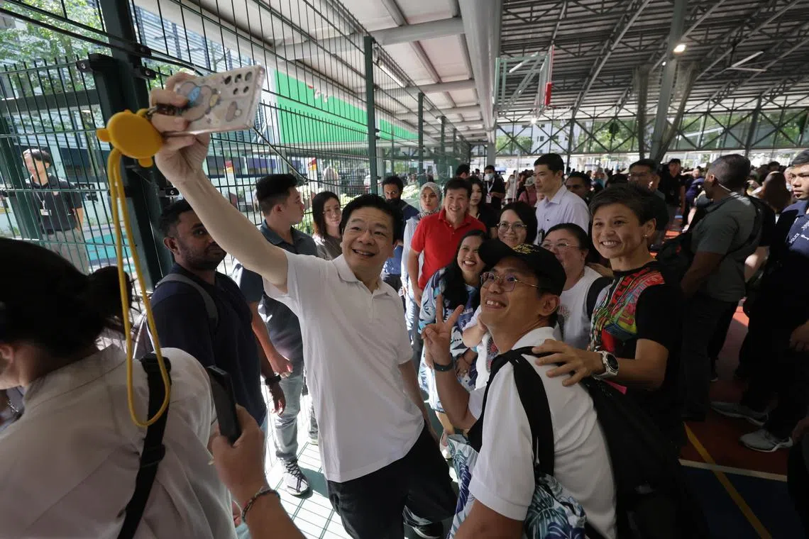 PM Lawrence Wong interacts with residents during the Sembawang GRC Health Carnival on April 20.
