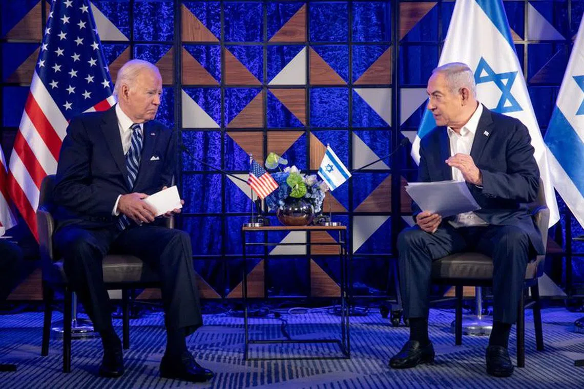 FILE PHOTO: U.S. President Joe Biden, left, meets with Israeli Prime Minister Benjamin Netanyahu, right, to discuss the ongoing conflict between Israel and Hamas, in Tel Aviv, Israel, Wednesday, Oct. 18, 2023. Miriam Alster/Pool via REUTERS