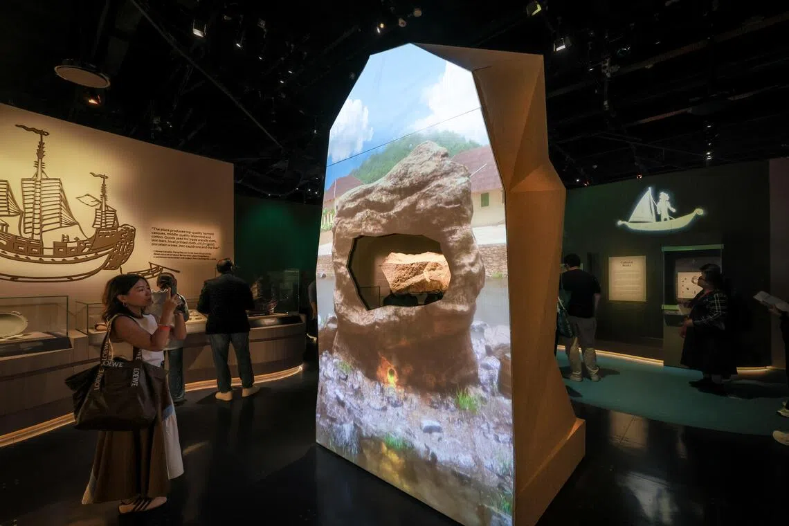The Singapore Stone wrapped in digital renderings of the past at the revamped Singapore History Gallery at the National Museum of Singapore, opening to the public on Oct 10.