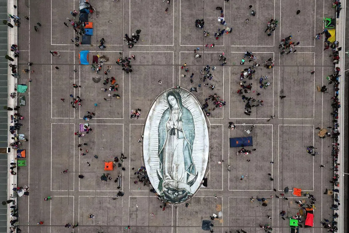 Thousands of pilgrims visiting Mexico City's Guadalupe Basilica on Dec 12, 2023 to honour the country's patron saint, the Virgin of Guadalupe. 