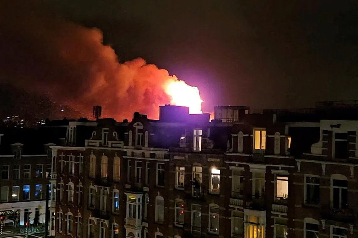 Fireworks accidents kill two in the Netherlands; fire destroys historic Amsterdam church